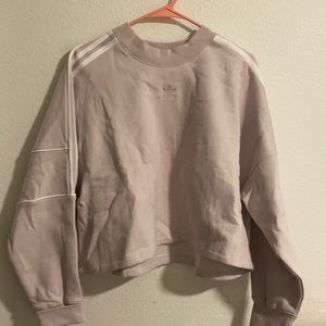 Adidas sweater, never worn. Size large in women’s. Has a loose fit